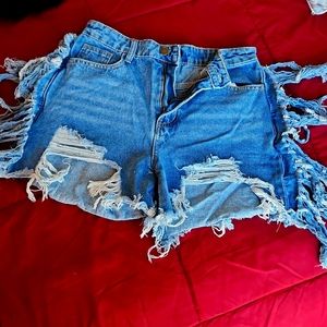 Distressed [medium wash] denim shorts